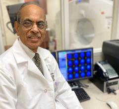 Feinstein Institutes' Thomas Chaly, Ph.D., poses in front of a PET-CT imaging machine. He has been instrumental in pushing for FDA approval of a new PET imaging agent, Fluorodopa F-18 (FDOPA), to combat Parkinson’s