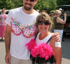 man and woman marching for breast cancer 