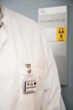 Wearing personal radiation measurement badges to measure dose exposure is crucial.