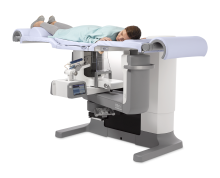 A patient prepares to have a tomosynthesis-guided prone breast biopsy using the Hologic Affirm prone biopsy system. 